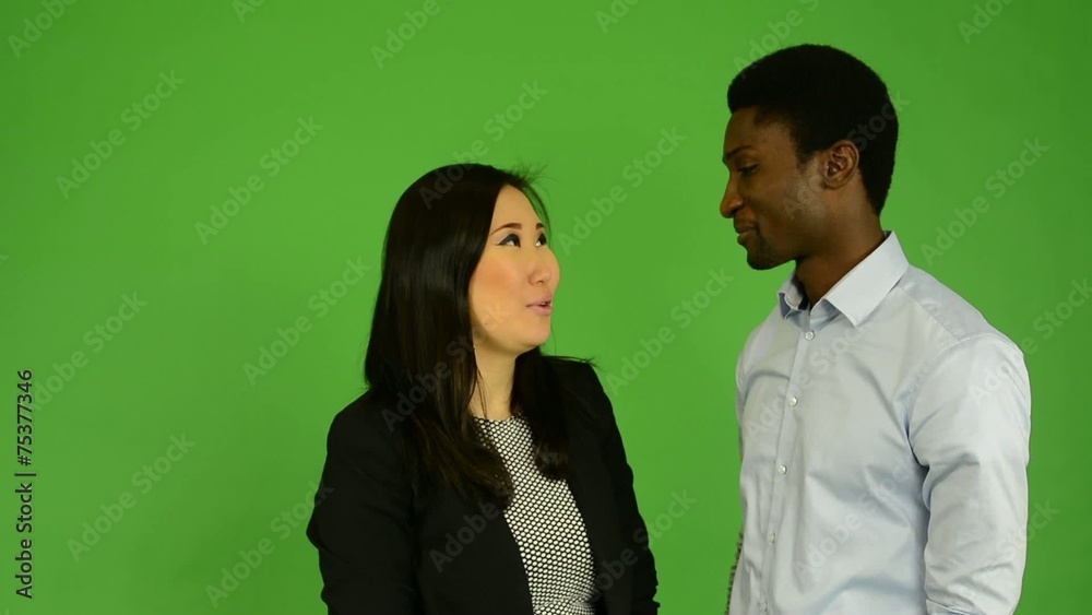 Happy multicultural couple talk (conversation)-green screen Happy multicultural couple talk (conversation)-green screen