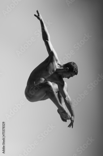 Fotografija Dance freedom concept. Young handsome ballet man in fly grace po