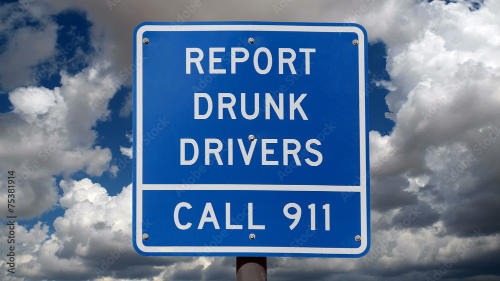 Report Drunk Drivers Sign with Time Lapse Clouds Report Drunk Drivers Sign with Time Lapse Clouds