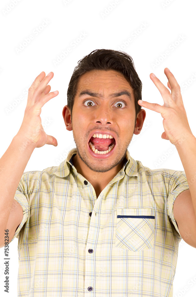 young handsome hispanic man expressing shock young handsome hispanic man expressing shock