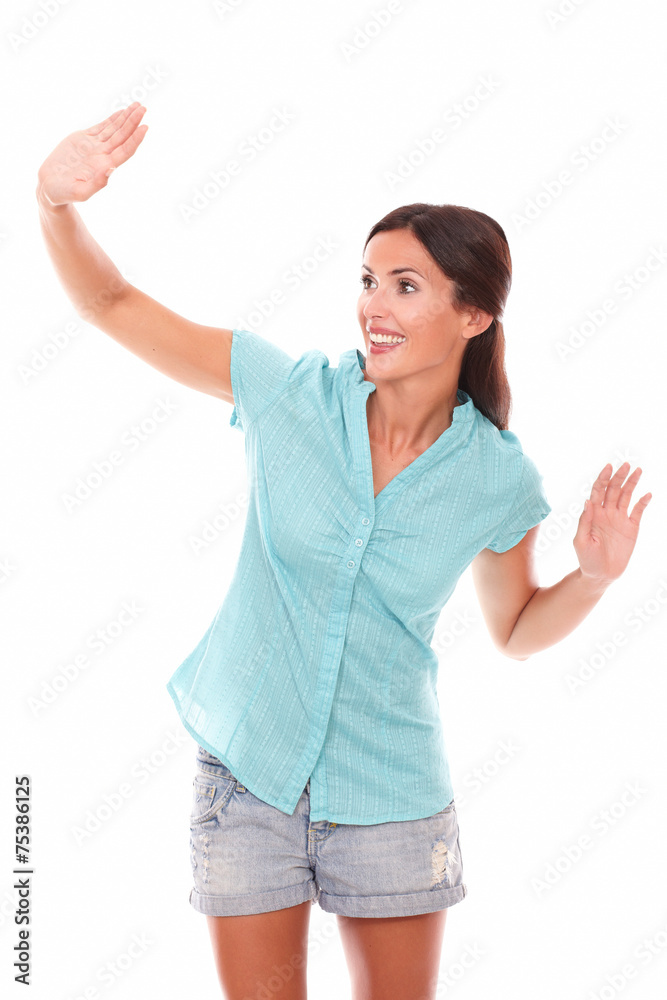 Friendly young female gesturing a greeting Friendly young female gesturing a greeting