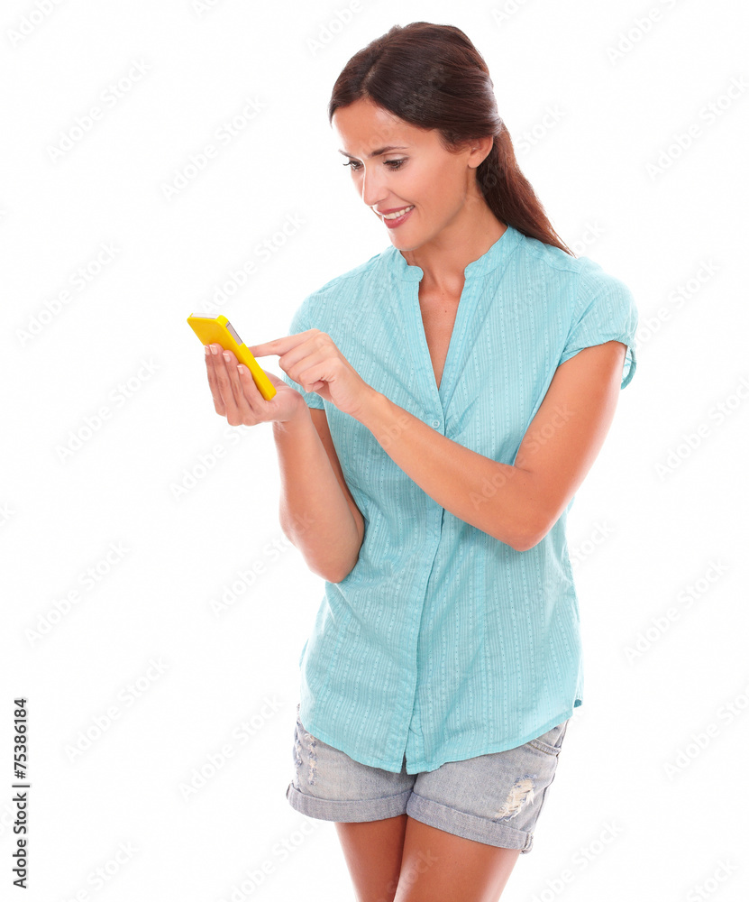 Young hispanic woman sending text message Young hispanic woman sending text message