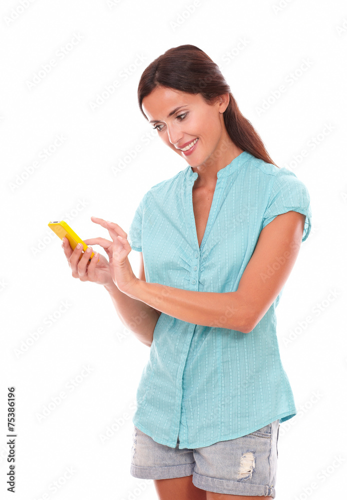Charming female sending and reading text message Charming female sending and reading text message
