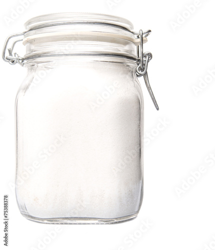 Obraz na plátně Granulated sugar in glass jar container