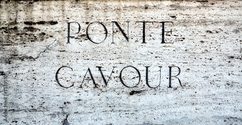 Stone plaque on Ponte Cavour in Rome, Italy