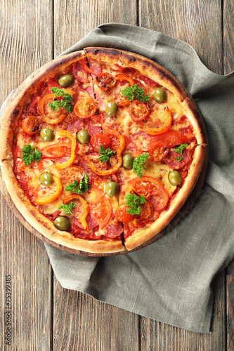 Tasty pizza with sausage and vegetables