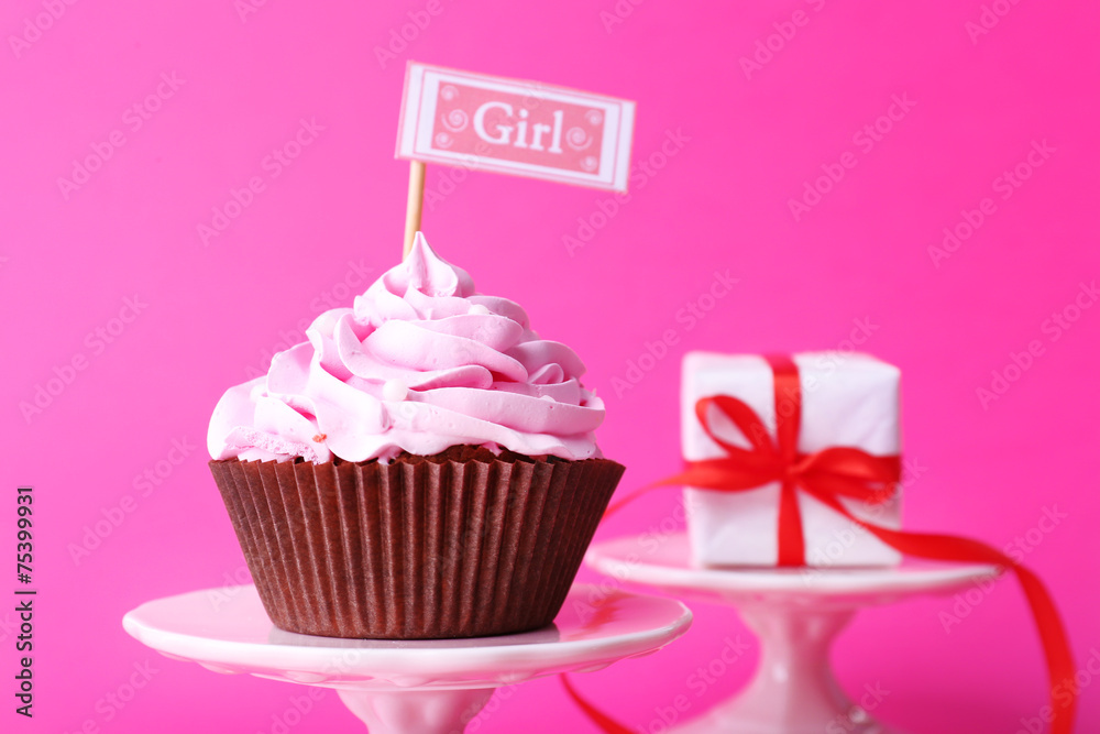 Delicious cupcake with inscription on pink background Delicious cupcake with inscription on pink background