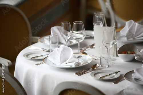 Restaurant set up, fine dining tables, plates and glasses