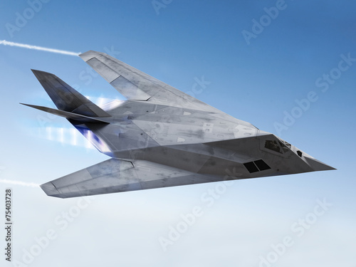 Stealth aircraft streaking through the sky photo