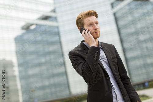 Young man on the street with mobile phone