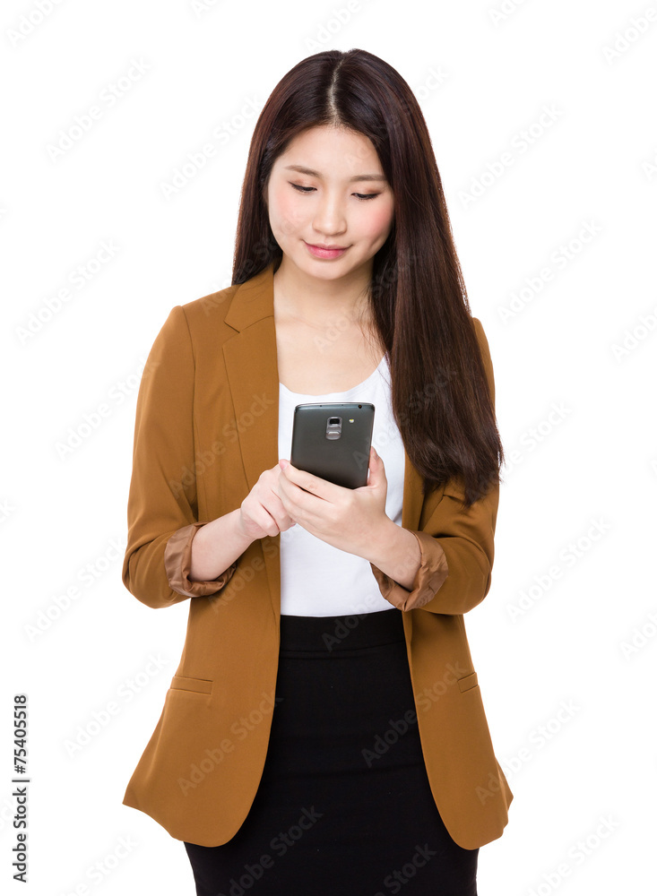 Businesswoman use of cellphone Businesswoman use of cellphone