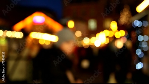 Shoppers at christmas market (bokeh)