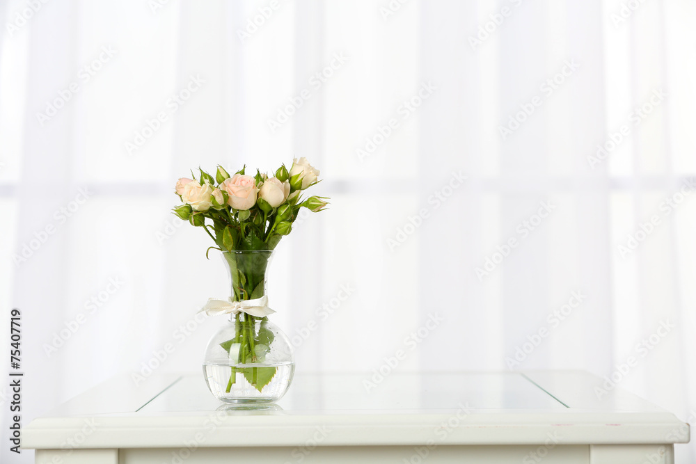 Beautiful bouquet of flowers in vase on window background Beautiful bouquet of flowers in vase on window background