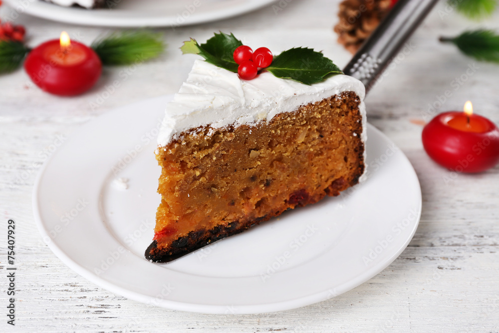 Slice of cake covered cream with Christmas decoration Slice of cake covered cream with Christmas decoration