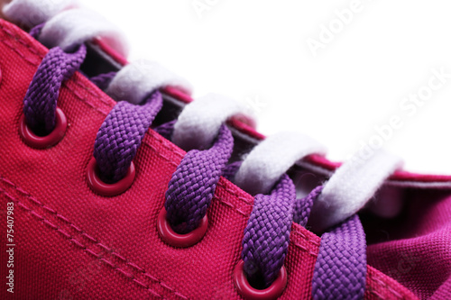 Process of tying shoelace, close-up