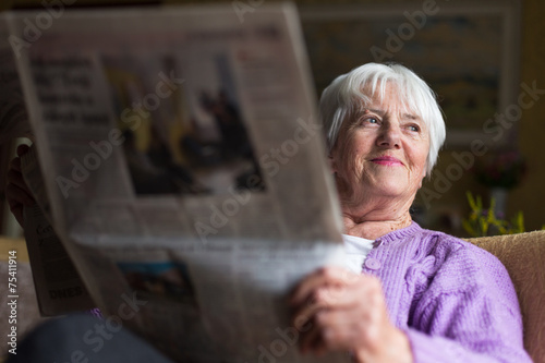 Photography Senior woman reading morning newspaper