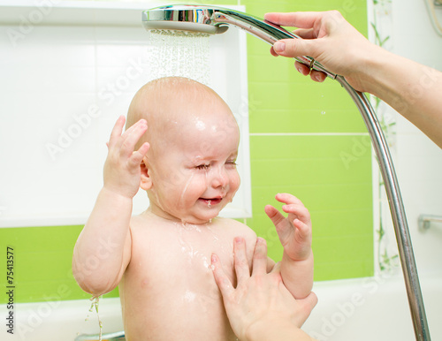 Cute child taking a bath