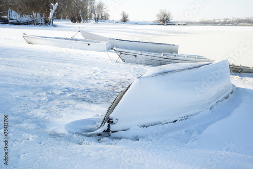 The thrown old boats on snow