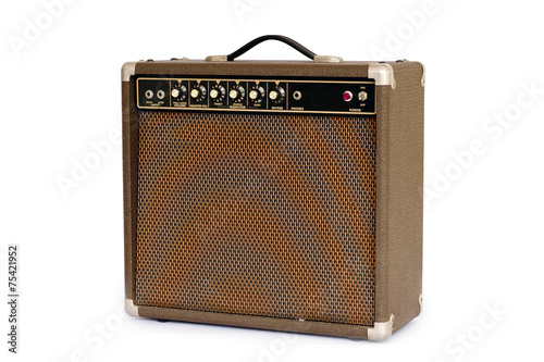 Brown electric guitar amplifier isolated on white background photo