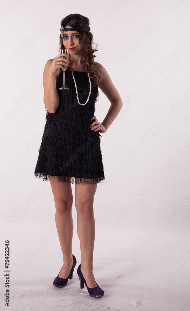 Young sexy girl posing in flapper style dress Young sexy girl posing in flapper style dress