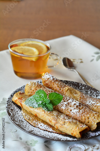 Crepes With Strawberry Jam With Cup Of Tea.