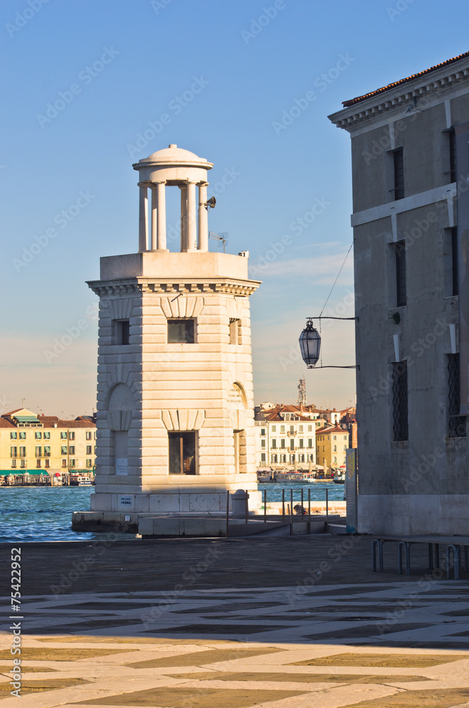 Old lighthouse in front of San Giorgio Maggiore church in Venice
