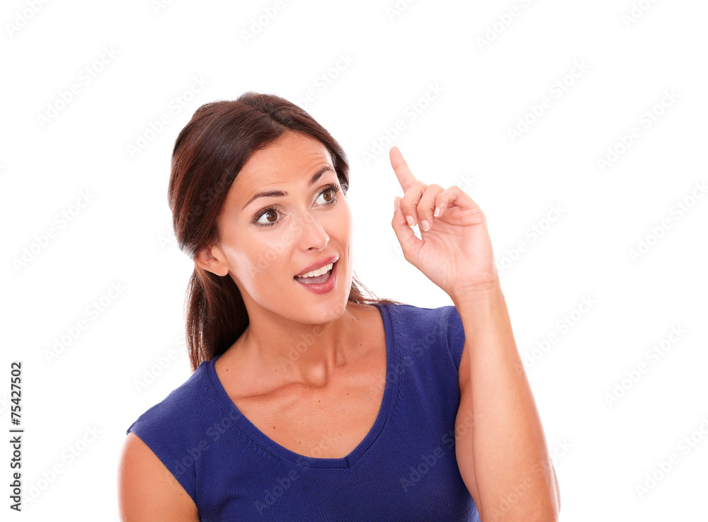 Beautiful woman with finger pointing up Beautiful woman with finger pointing up