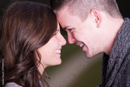 Closeup of a happy young couple face to face