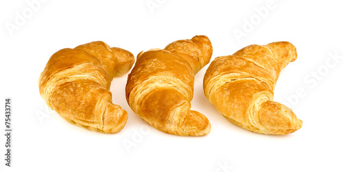 Three butter croissant isolated on white background