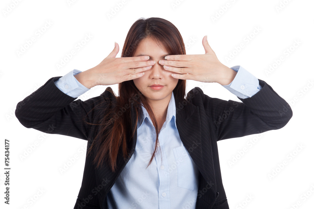 Young Asian businesswoman close her eyes with both hands Young Asian businesswoman close her eyes with both hands