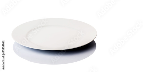 Empty white dinner plate over white background 