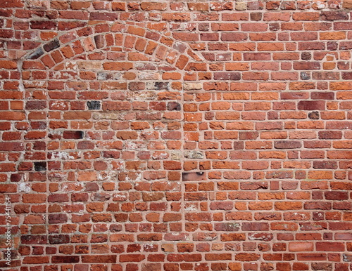 Blind secret hidden entrance in old red brickwall