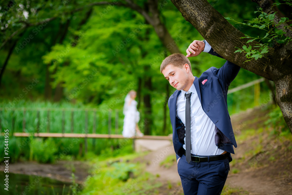 the bride and groom walk in the park the bride and groom walk in the park