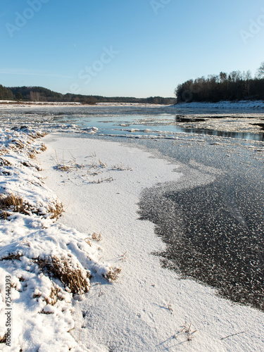 beautiful snowy winter landscape with frozen river