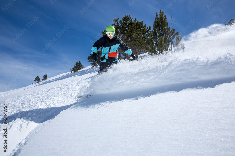 Snowboarder moving down
