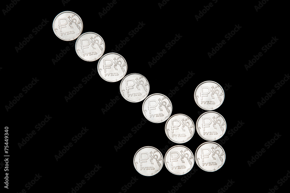 Down arrow made of Russian ruble coins Down arrow made of Russian ruble coins