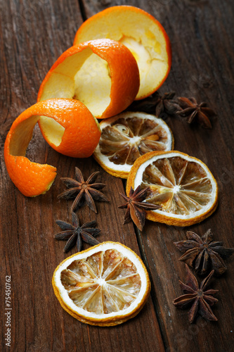 Fototapeta Naklejka Na Ścianę i Meble -  Dried peel of an orange and spice on a table