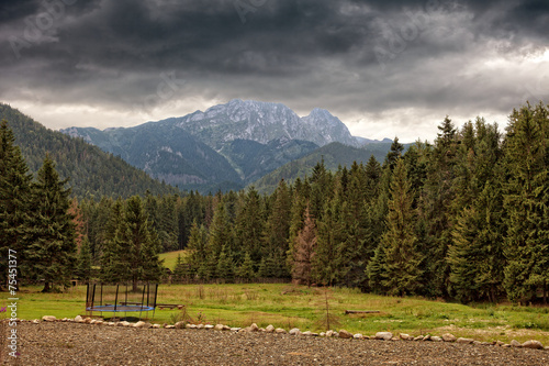 Tatra Mountains with Giewont against dramatic sky, Poland.