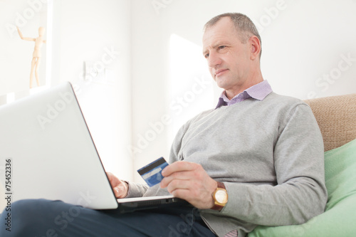 Adult man making online buying