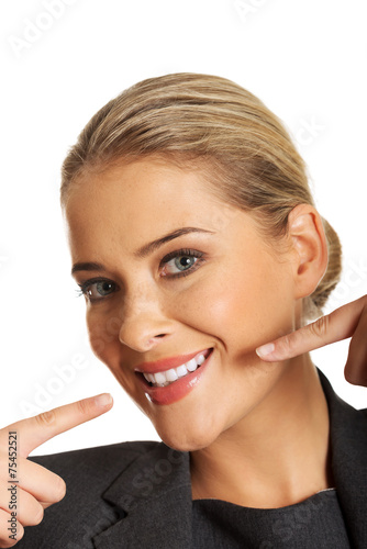 Woman showing her perfect white teeth