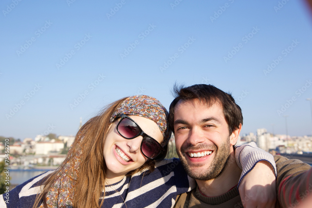 Young couple taking selfie together