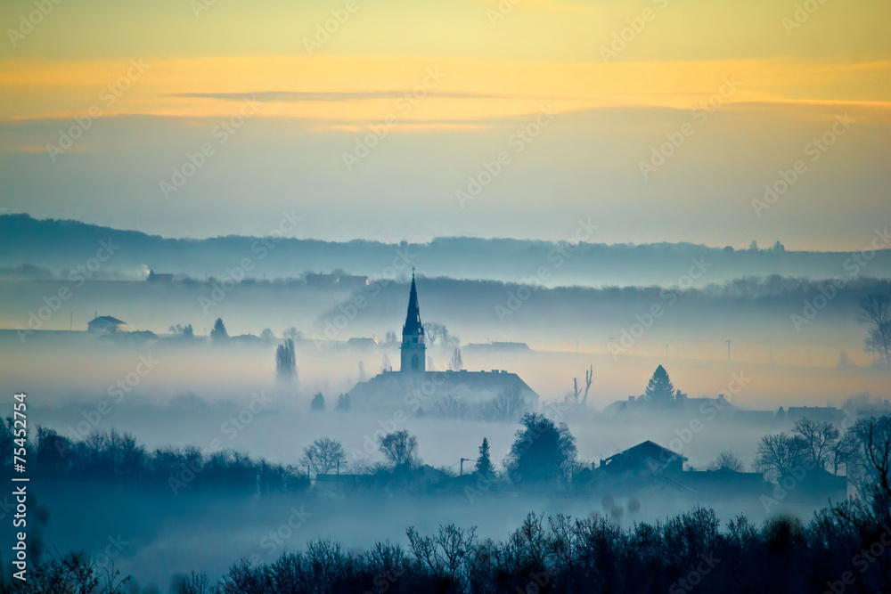 Fototapeta premium Krizevci cathedral in fog landscape