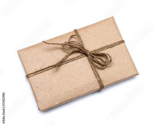 parcel wrapped with brown kraft paper isolated on white backgrou