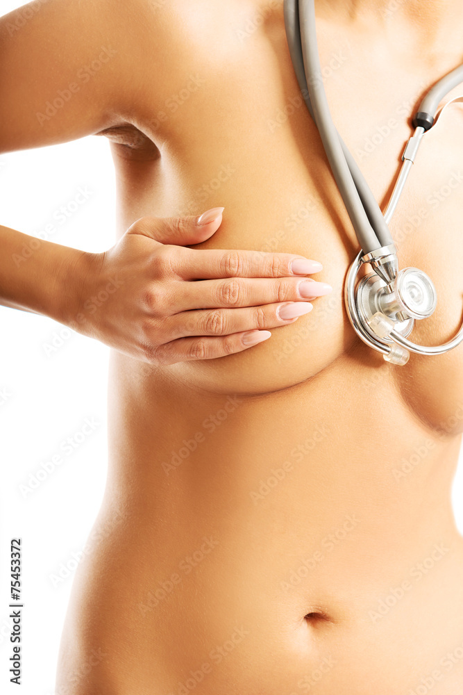Nude woman with a stethoscope covering her breast