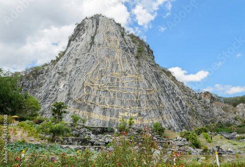 Carved buddha image on the cliff at Khao Chee Chan, Thailand photo