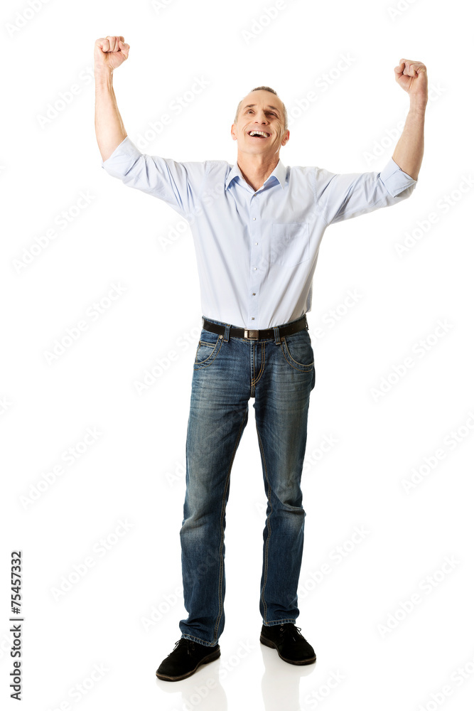 Full length cheerful man with hands up Full length cheerful man with hands up