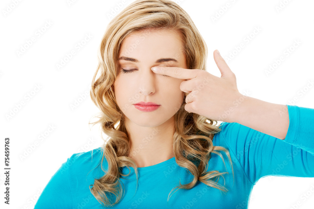 Portrait of a woman rubbing eyes Portrait of a woman rubbing eyes