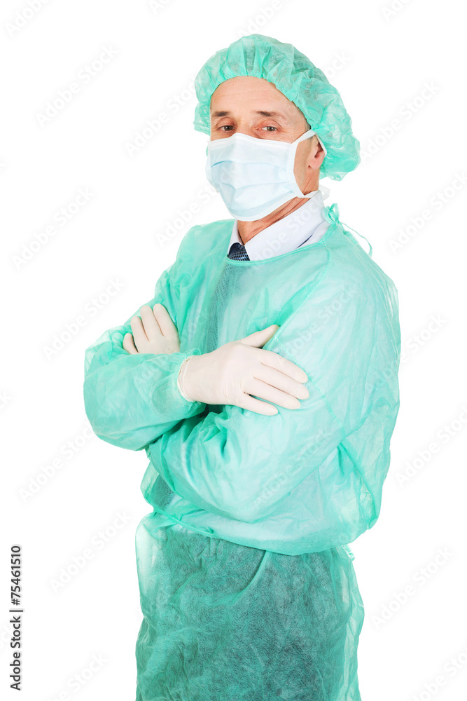 Side view male doctor with folded arms Side view male doctor with folded arms