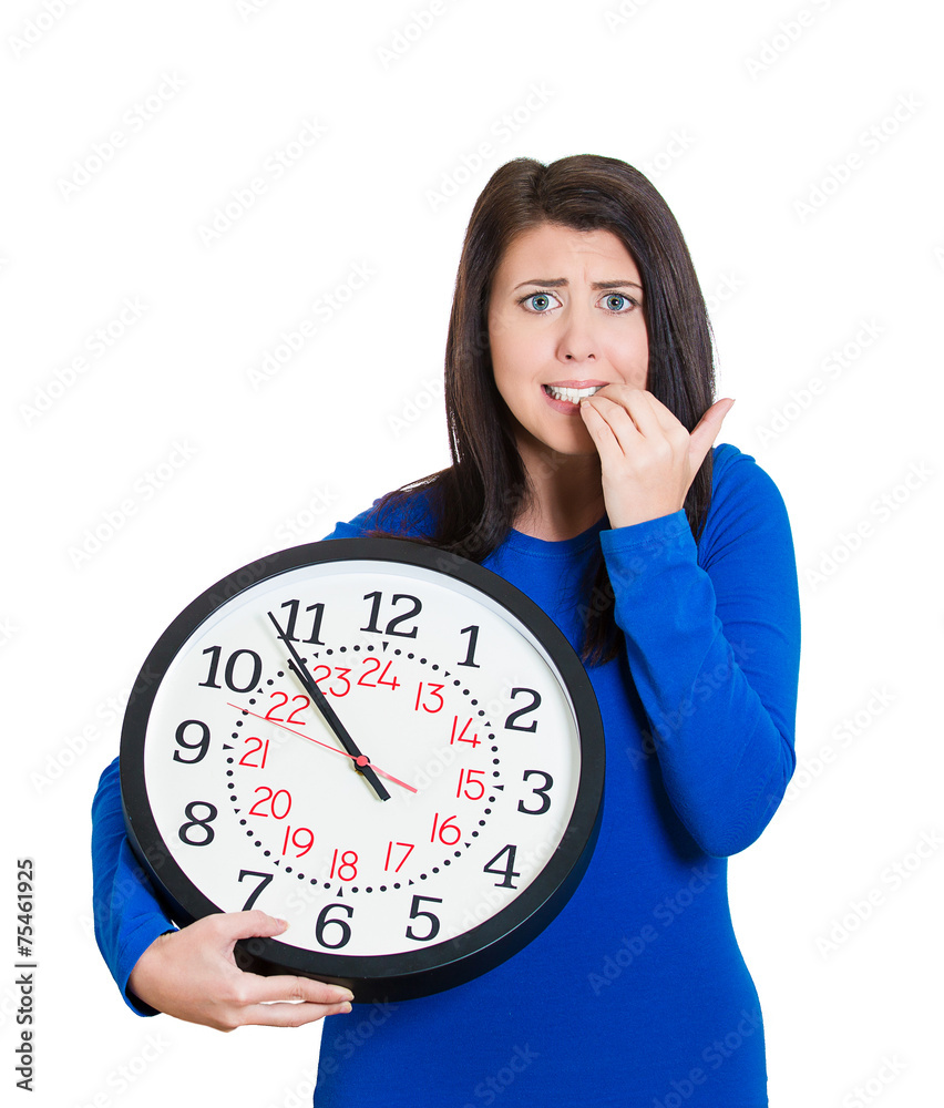 woman worker holding clock looking anxiously, lack of time woman worker holding clock looking anxiously, lack of time