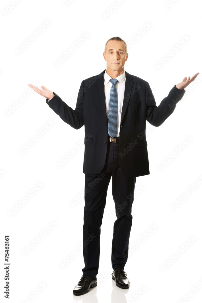 Full length businessman in undecided gesture Full length businessman in undecided gesture